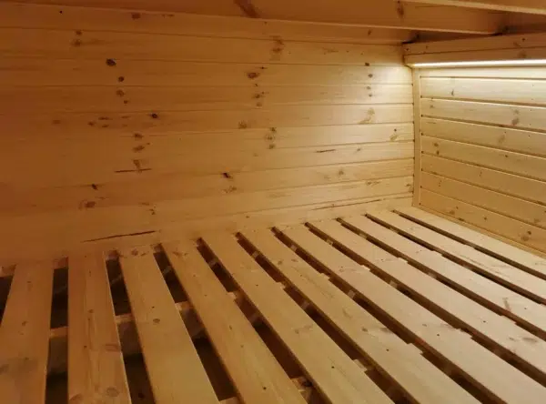 Wooden camping pod, close-up of slatted sleeping platform
