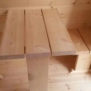 Wooden camping pod, close-up of wooden table construction