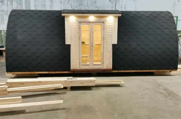 Wooden camping pod, closed side entrance with exterior lights