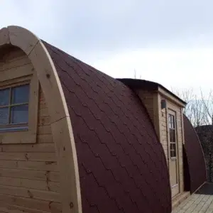 Wooden camping pod, end window and projecting side entrance