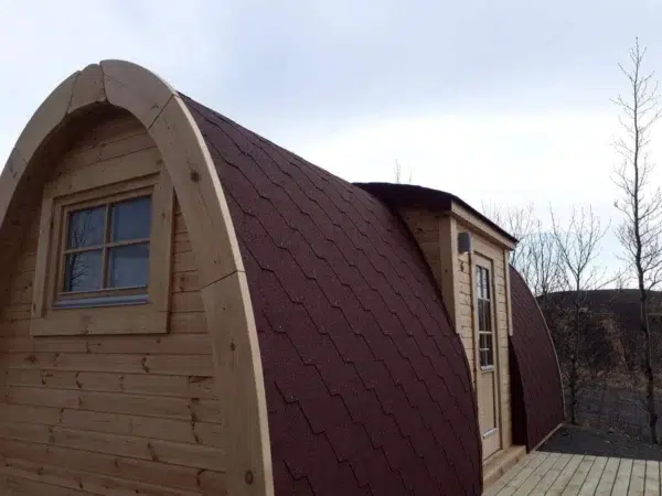 Wooden camping pod, end window and projecting side entrance