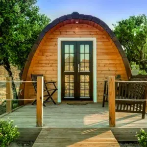 Wooden camping pod, front deck with outdoor bench