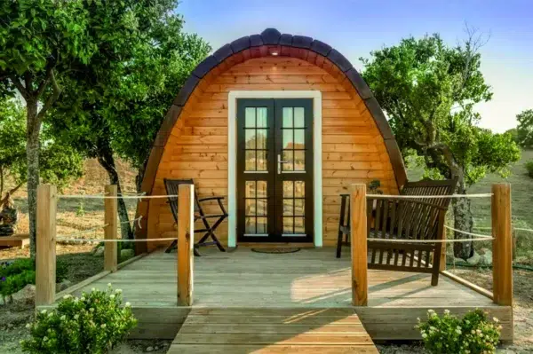 Wooden camping pod, front deck with outdoor bench