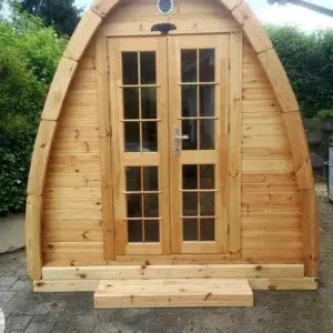 Wooden camping pod, front exterior with glazed double doors