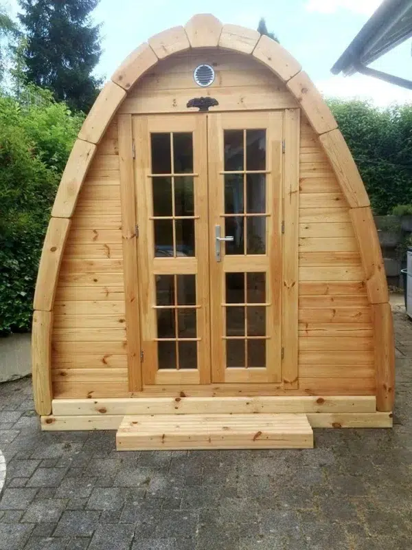Wooden camping pod, front exterior with glazed double doors