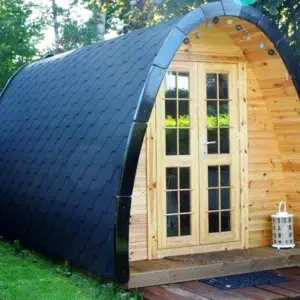 Wooden camping pod, front exterior with glazed double doors