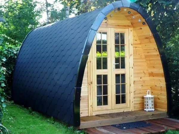 Wooden camping pod, front exterior with glazed double doors