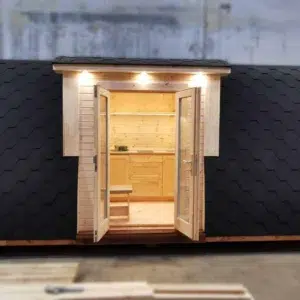 Wooden camping pod, front view of open side entrance