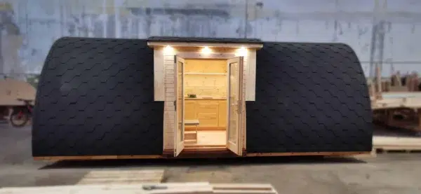 Wooden camping pod, front view of open side entrance