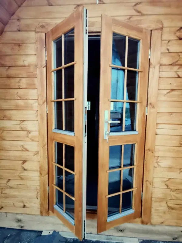 Wooden camping pod, glazed double entrance doors