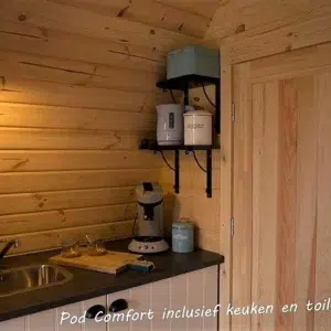 Wooden camping pod, kitchenette and internal wooden door