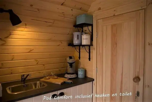 Wooden camping pod, kitchenette and internal wooden door