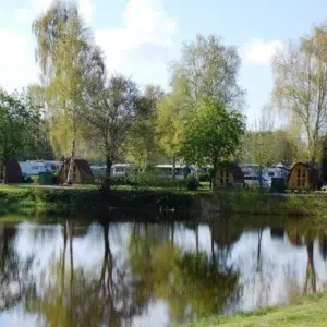 Wooden camping pod, lakeside setting with camping pods