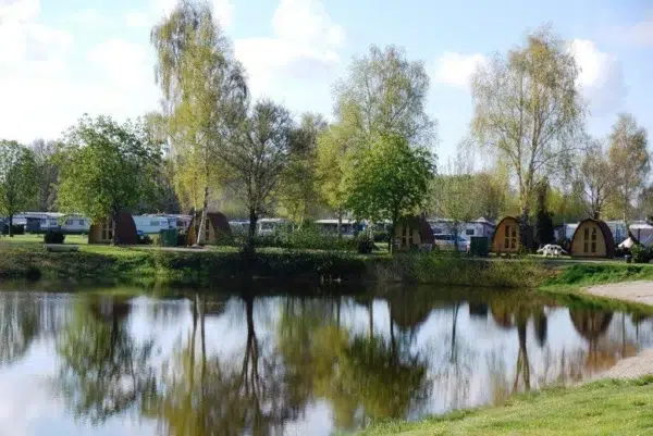 Wooden camping pod, lakeside setting with camping pods