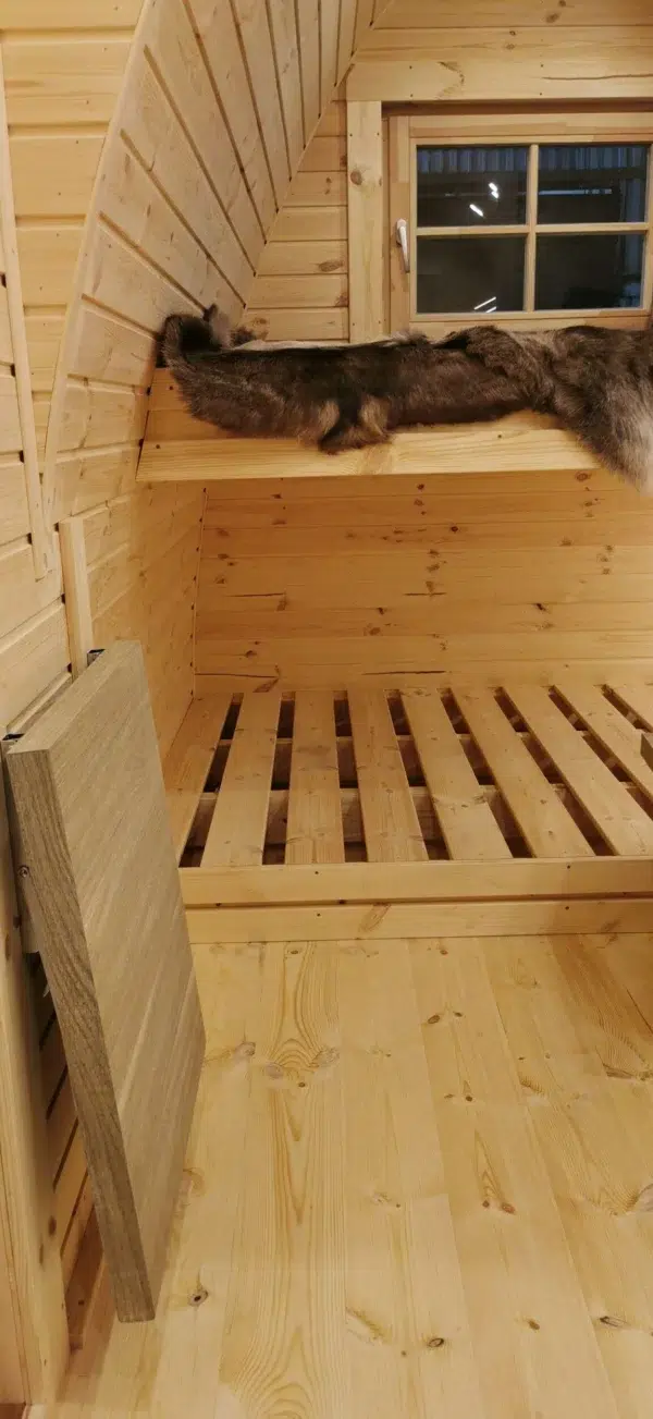 Wooden camping pod, lower slatted sleeping platform