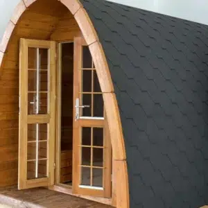 Wooden camping pod, open front doors and curved roof