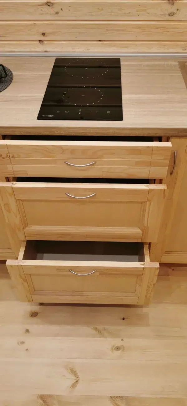 Wooden camping pod, open kitchen storage drawers