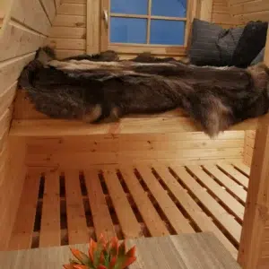 Wooden camping pod, raised sleeping area with lower slatted platform