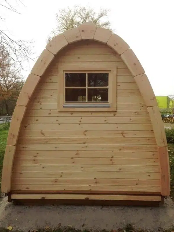 Wooden camping pod, rear exterior with small window
