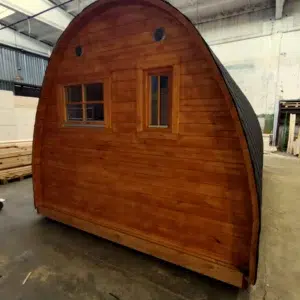 Wooden camping pod, rear exterior with two windows