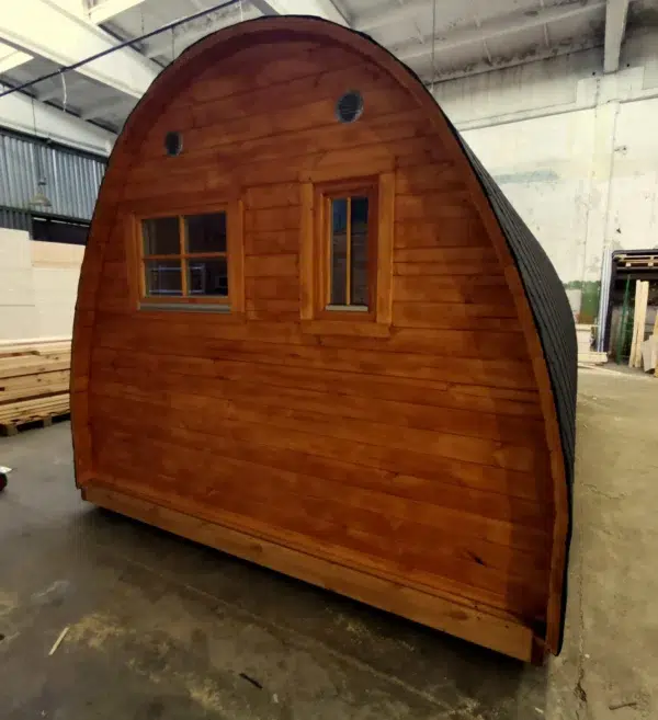 Wooden camping pod, rear exterior with two windows