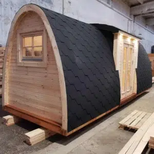 Wooden camping pod, rear and side exterior with shingle roof