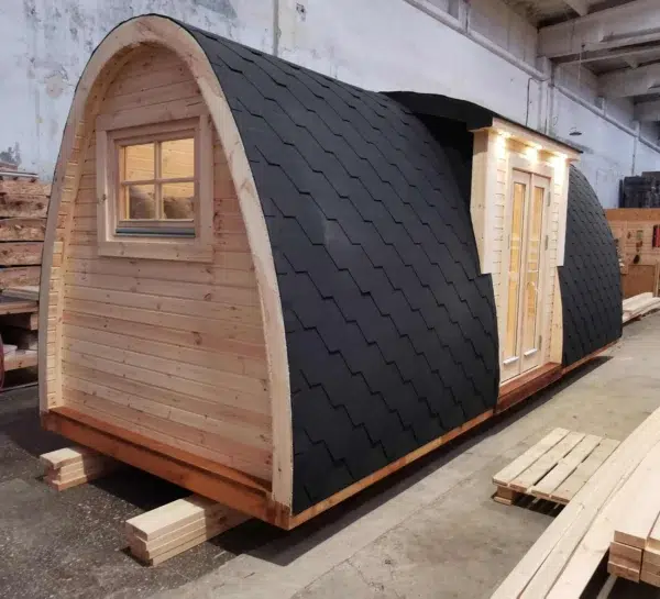 Wooden camping pod, rear and side exterior with shingle roof
