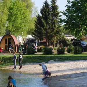 Wooden camping pod, riverside campsite with camping pods