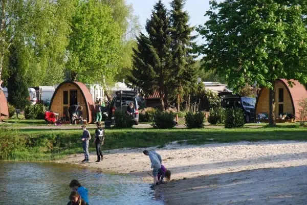 Wooden camping pod, riverside campsite with camping pods