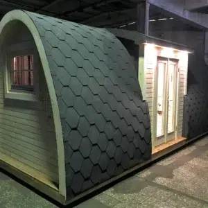 Wooden camping pod, side and end exterior with entrance lighting