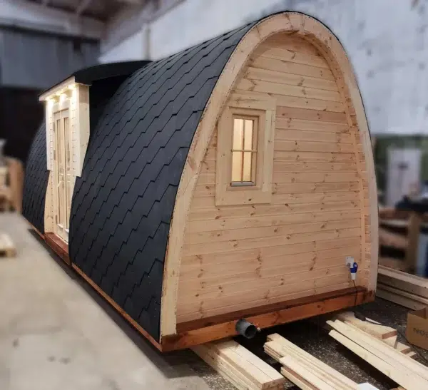 Wooden camping pod, side and end exterior with small window