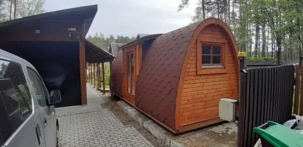 Wooden camping pod, side entrance and end window