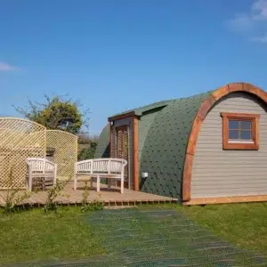 Wooden camping pod, side entrance and furnished deck