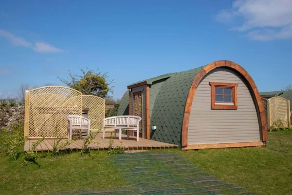 Wooden camping pod, side entrance and furnished deck
