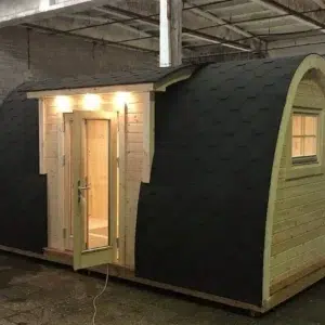 Wooden camping pod, side entrance with projecting canopy