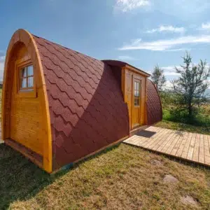 Wooden camping pod, side exterior with entrance deck
