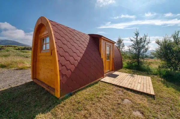 Wooden camping pod, side exterior with entrance deck