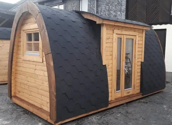 Wooden camping pod, side exterior with projecting entrance