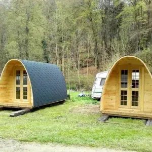 Wooden camping pod, two camping pods on a grassy site