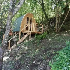 Wooden camping pod, woodland pod on a raised platform