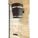 TESLI 20 L thermo ash sauna shower bucket with stainless steel insert, installed on a wooden wall with pull chain